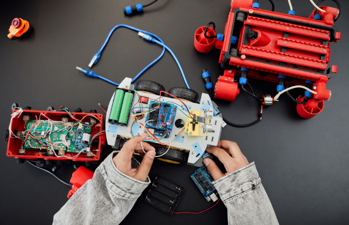 students playing with a robot